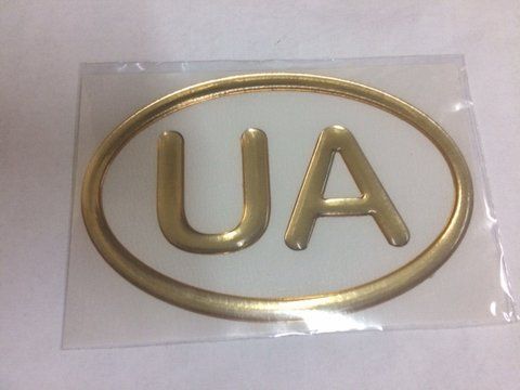 Наліпка силіконова "UA" контур в овалі золота (8х12) &mdash; основне фото товару